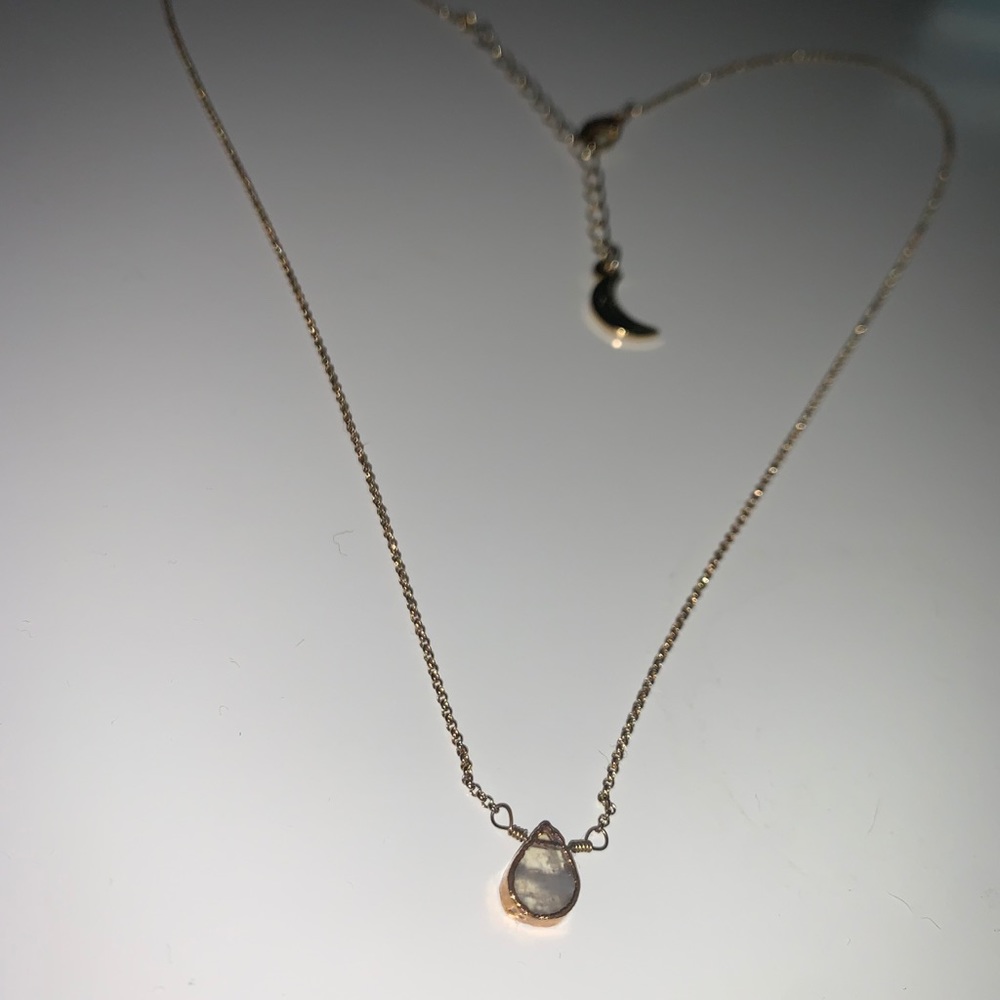 Gold necklace with gemstone